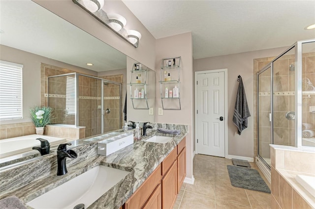 3911 91st Ave E, Parrish, FL 34219 - bathroom with a stall shower, a garden tub, tile patterned flooring, and double vanity
