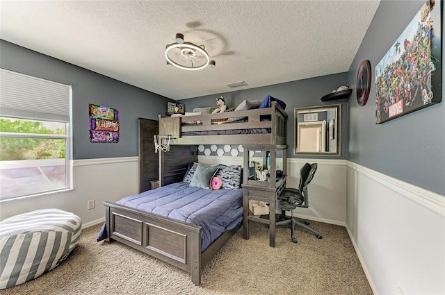 3911 91st Ave E, Parrish, FL 34219 - bedroom featuring carpet floors and a textured ceiling