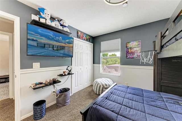 3911 91st Ave E, Parrish, FL 34219 - carpeted bedroom featuring a closet and a textured ceiling