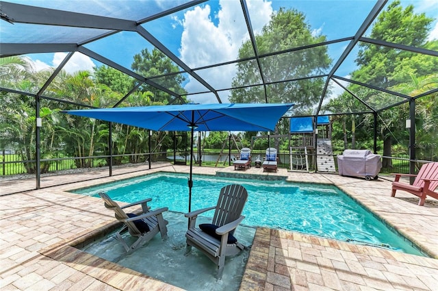 3911 91st Ave E, Parrish, FL 34219 - outdoor pool with area for grilling, a patio area, and a lanai