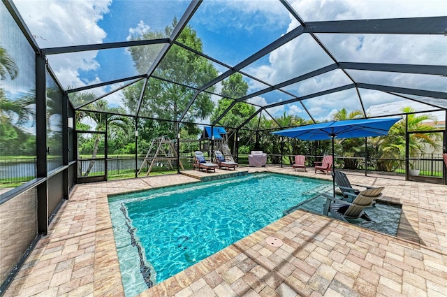 3911 91st Ave E, Parrish, FL 34219 - view of swimming pool featuring a patio and glass enclosure
