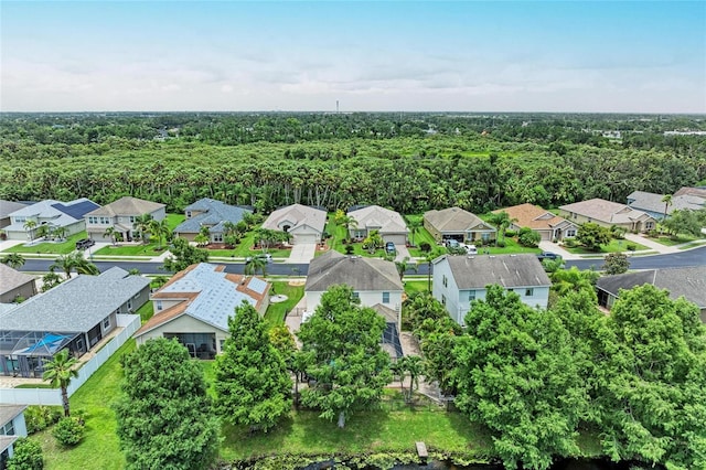 3911 91st Ave E, Parrish, FL 34219 - aerial perspective of suburban area featuring a forest