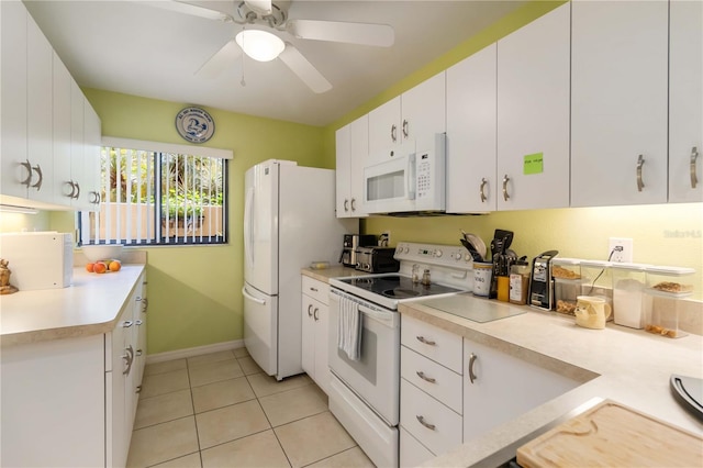 5705 Ashton Way Unit 5705, Sarasota, FL 34231 - kitchen with white appliances, light countertops, light tile patterned floors, white cabinets, and a ceiling fan