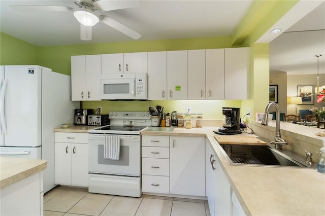 5705 Ashton Way Unit 5705, Sarasota, FL 34231 - kitchen featuring white appliances, light countertops, white cabinetry, a ceiling fan, and light tile patterned floors