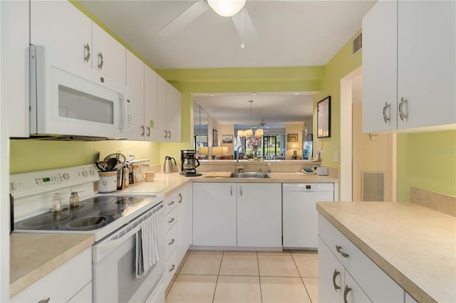 5705 Ashton Way Unit 5705, Sarasota, FL 34231 - kitchen with white appliances, a ceiling fan, light countertops, and white cabinets