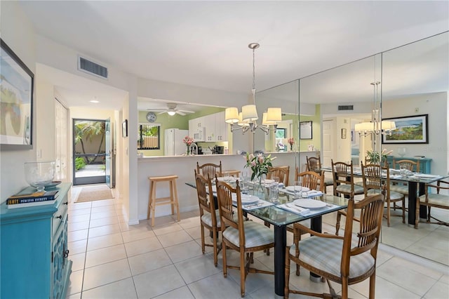 5705 Ashton Way Unit 5705, Sarasota, FL 34231 - dining area with a chandelier and light tile patterned floors