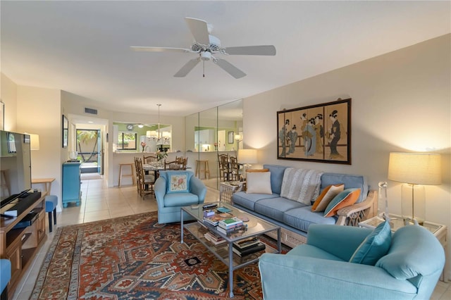 5705 Ashton Way Unit 5705, Sarasota, FL 34231 - tiled living area featuring a ceiling fan and a chandelier