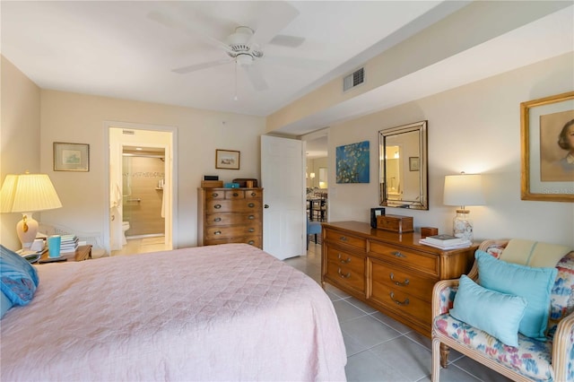 5705 Ashton Way Unit 5705, Sarasota, FL 34231 - bedroom featuring light tile patterned floors, connected bathroom, and ceiling fan