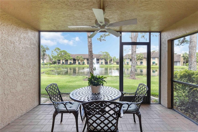 5705 Ashton Way Unit 5705, Sarasota, FL 34231 - sunroom featuring a water view, a ceiling fan, and a residential view