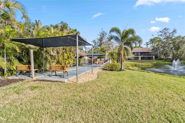 5705 Ashton Way Unit 5705, Sarasota, FL 34231 - view of grassy yard with a patio area and a water view