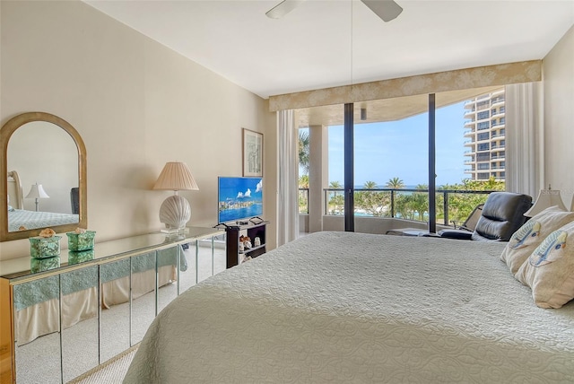 1211 Gulf Of Mexico Dr Unit 105, Longboat Key, FL 34228 - bedroom featuring ceiling fan and carpet