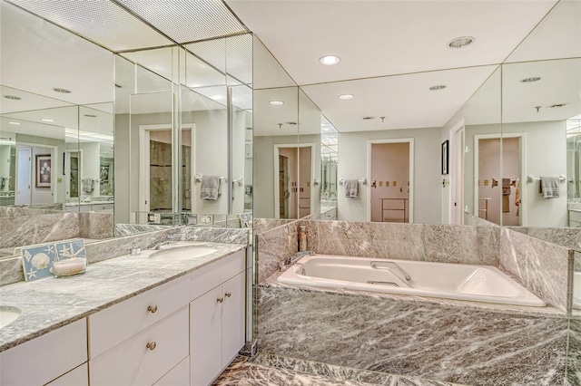 1211 Gulf Of Mexico Dr Unit 105, Longboat Key, FL 34228 - full bathroom featuring a garden tub, double vanity, and recessed lighting