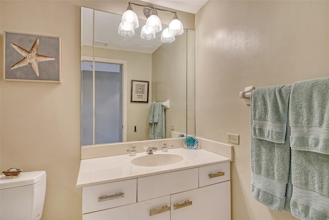 1211 Gulf Of Mexico Dr Unit 105, Longboat Key, FL 34228 - bathroom featuring vanity and toilet