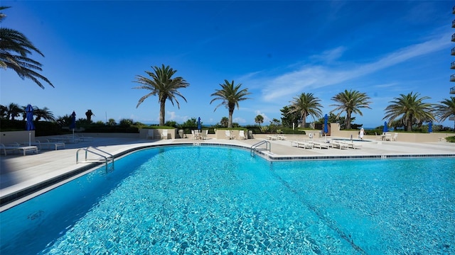 1211 Gulf Of Mexico Dr Unit 105, Longboat Key, FL 34228 - community pool featuring a patio area