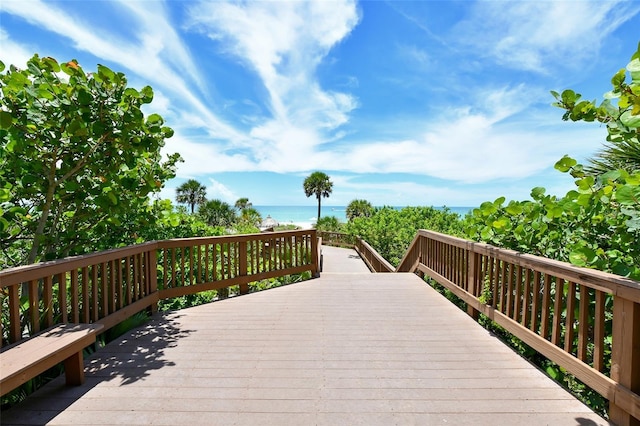 1211 Gulf Of Mexico Dr Unit 105, Longboat Key, FL 34228 - wooden terrace featuring view of water and beach