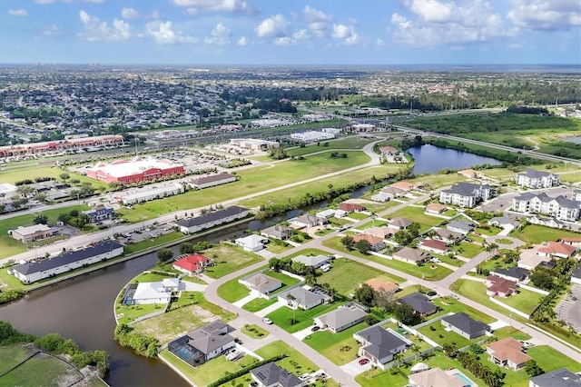 1402 SW 4th Ln, Cape Coral, FL 33991 - aerial overview of property's location featuring a large body of water and nearby suburban area