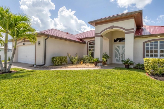 1402 SW 4th Ln, Cape Coral, FL 33991 - mediterranean / spanish-style home featuring a standing seam roof, a metal roof, stucco siding, and a front yard