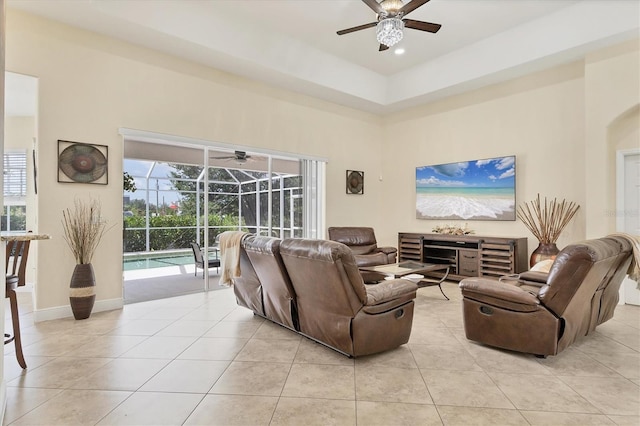 1402 SW 4th Ln, Cape Coral, FL 33991 - living area featuring a sunroom, a ceiling fan, light tile patterned floors, and a high ceiling