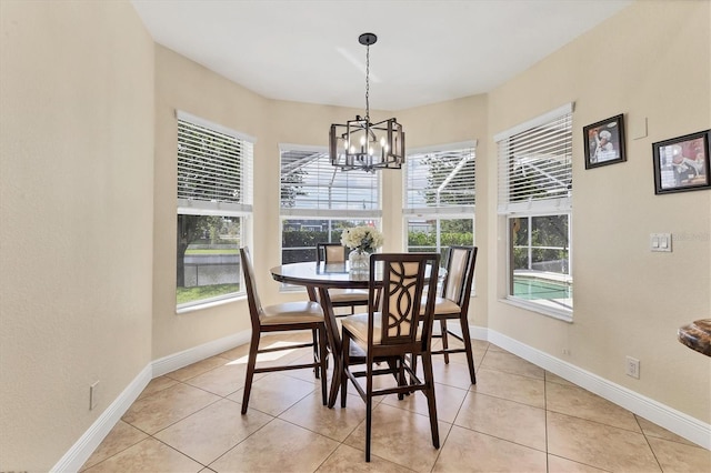 1402 SW 4th Ln, Cape Coral, FL 33991 - dining space with healthy amount of natural light, a chandelier, and light tile patterned floors