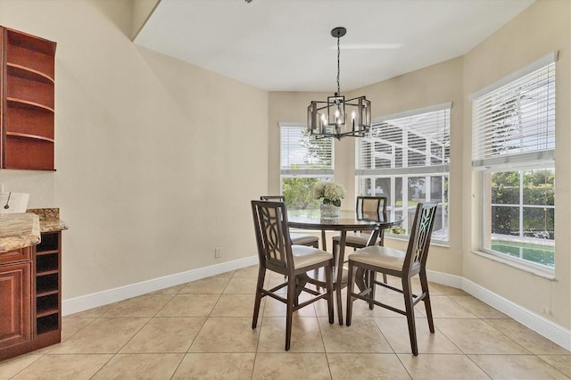 1402 SW 4th Ln, Cape Coral, FL 33991 - dining area with a chandelier and light tile patterned floors