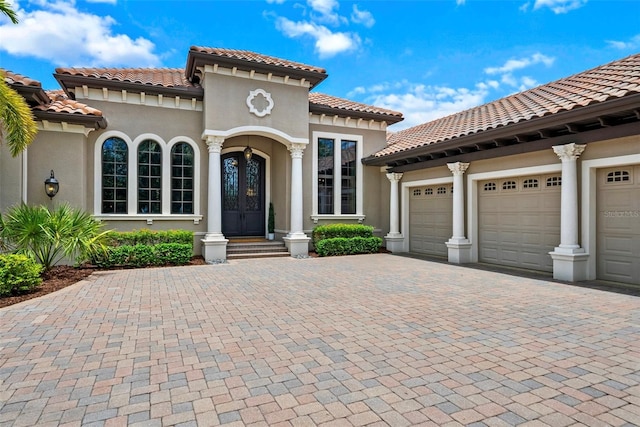 6926 Lacantera Cir, Lakewood Ranch, FL 34202 - mediterranean / spanish-style house featuring driveway, a garage, stucco siding, and a tile roof