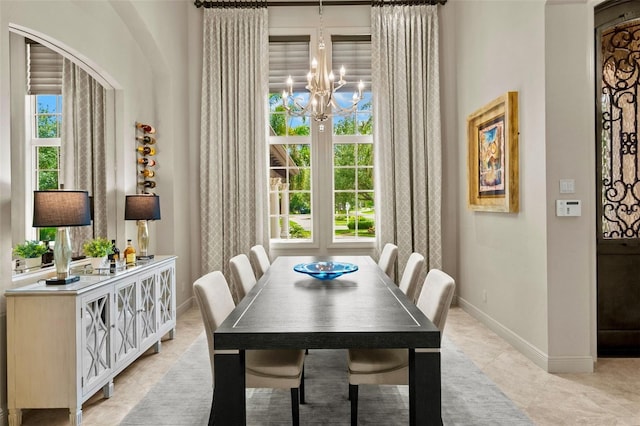 6926 Lacantera Cir, Lakewood Ranch, FL 34202 - dining space featuring a chandelier and light tile patterned floors