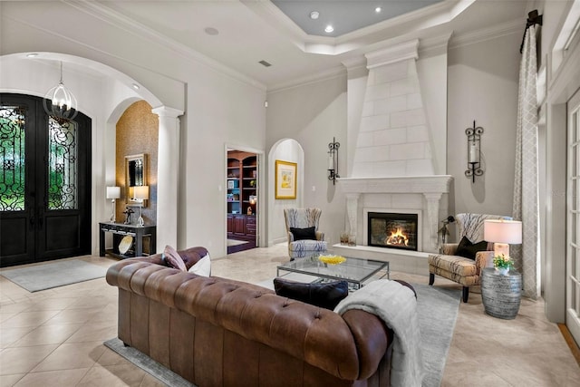 6926 Lacantera Cir, Lakewood Ranch, FL 34202 - living area featuring arched walkways, ornate columns, french doors, ornamental molding, and light tile patterned floors
