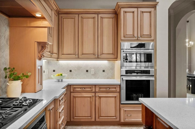 6926 Lacantera Cir, Lakewood Ranch, FL 34202 - kitchen featuring double oven, gas cooktop, light countertops, tasteful backsplash, and custom exhaust hood
