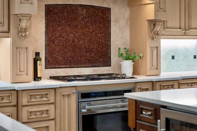 6926 Lacantera Cir, Lakewood Ranch, FL 34202 - kitchen featuring appliances with stainless steel finishes, light countertops, backsplash, and beverage cooler