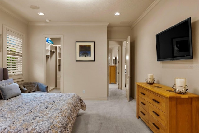 6926 Lacantera Cir, Lakewood Ranch, FL 34202 - bedroom with light colored carpet, crown molding, a spacious closet, and recessed lighting