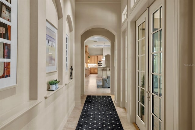 6926 Lacantera Cir, Lakewood Ranch, FL 34202 - hallway with french doors and arched walkways