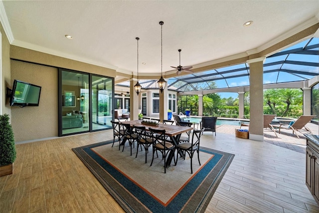 6926 Lacantera Cir, Lakewood Ranch, FL 34202 - dining room featuring a textured wall, wood finished floors, plenty of natural light, ornamental molding, and recessed lighting