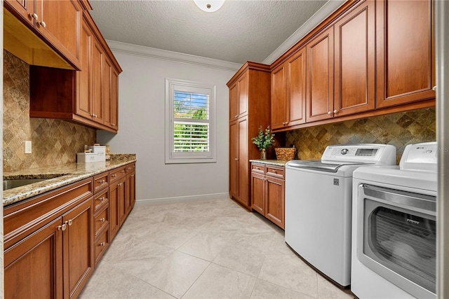 6926 Lacantera Cir, Lakewood Ranch, FL 34202 - washroom featuring cabinet space, washer and dryer, ornamental molding, and a textured ceiling