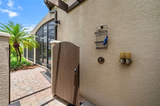 6926 Lacantera Cir, Lakewood Ranch, FL 34202 - view of property exterior with stucco siding and a lanai