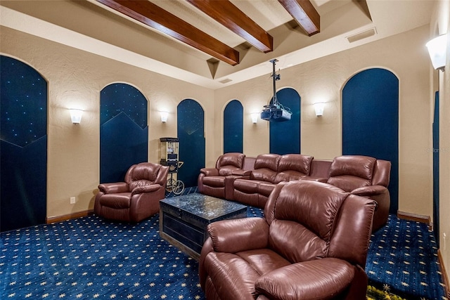 6926 Lacantera Cir, Lakewood Ranch, FL 34202 - carpeted cinema room featuring beamed ceiling, arched walkways, and a textured wall