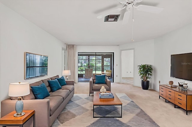 3557 Wilkinson Woods Dr, Sarasota, FL 34231 - living area featuring light carpet and a ceiling fan