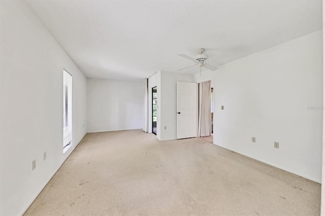 3557 Wilkinson Woods Dr, Sarasota, FL 34231 - spare room featuring light colored carpet and ceiling fan