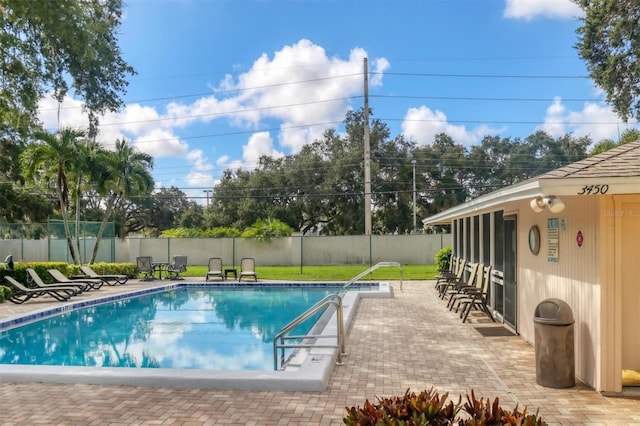 3557 Wilkinson Woods Dr, Sarasota, FL 34231 - community pool featuring a fenced backyard and a patio area