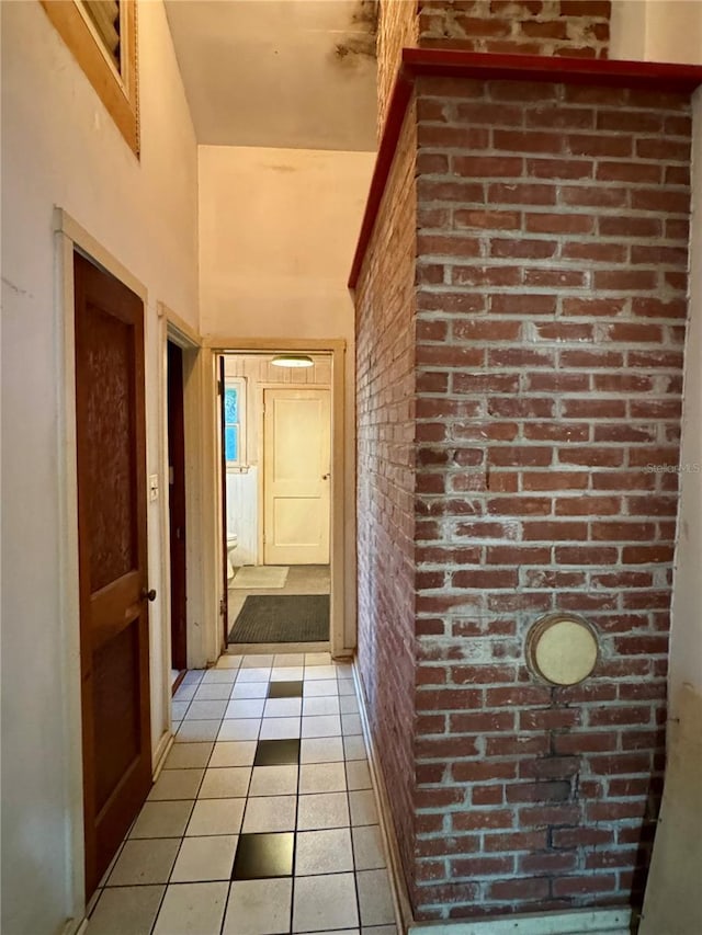 1109 Patterson Dr, Sarasota, FL 34234 - corridor with light tile patterned flooring