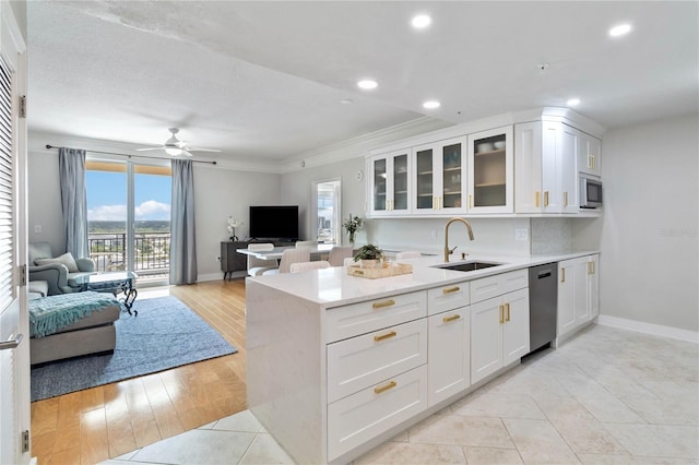 750 N Tamiami Trl Unit 1616, Sarasota, FL 34236 - kitchen featuring appliances with stainless steel finishes, open floor plan, healthy amount of natural light, ornamental molding, and recessed lighting