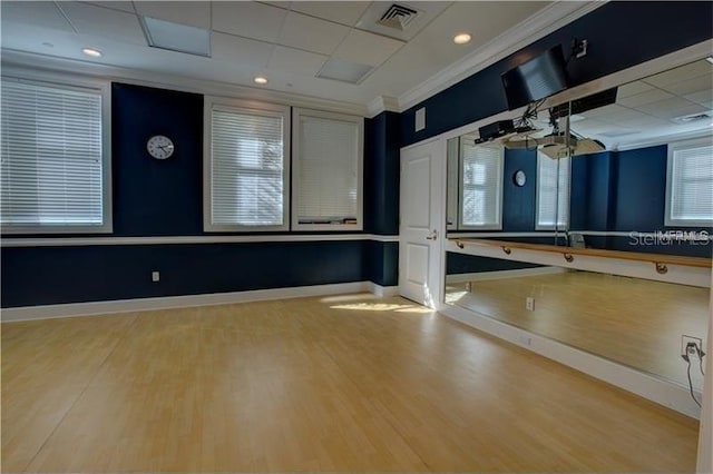 750 N Tamiami Trl Unit 1616, Sarasota, FL 34236 - workout area featuring wood finished floors and ornamental molding