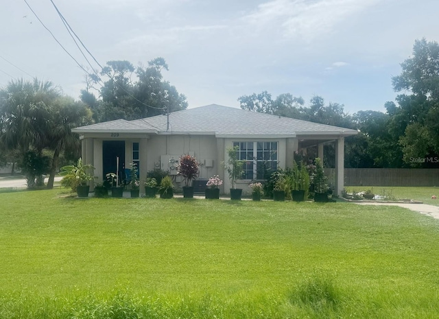 803 E Shell Point Rd, Ruskin, FL 33570 - view of front of property featuring a front lawn and stucco siding