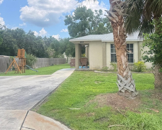 803 E Shell Point Rd, Ruskin, FL 33570 - view of yard featuring a playground and driveway