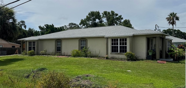 803 E Shell Point Rd, Ruskin, FL 33570 - ranch-style house featuring stucco siding and a front lawn