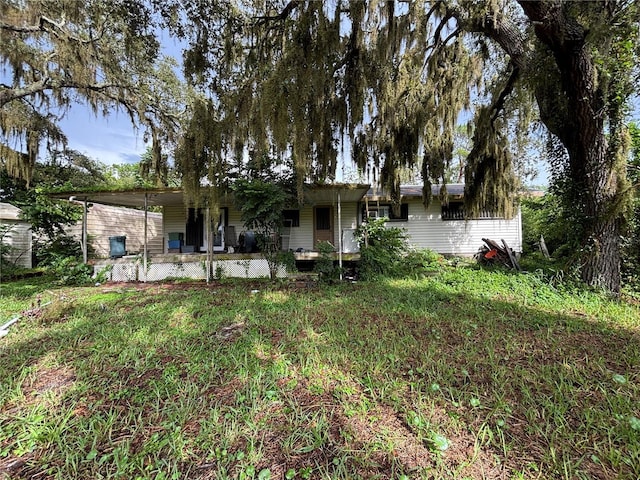 12345 Terra Ceia Ave, New Port Richey, FL 34654 - rear view of house featuring a porch
