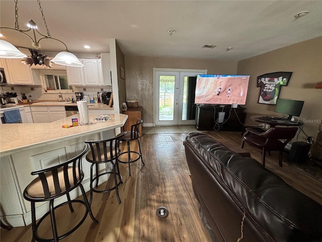 12345 Terra Ceia Ave, New Port Richey, FL 34654 - living room featuring dark wood-style floors and recessed lighting