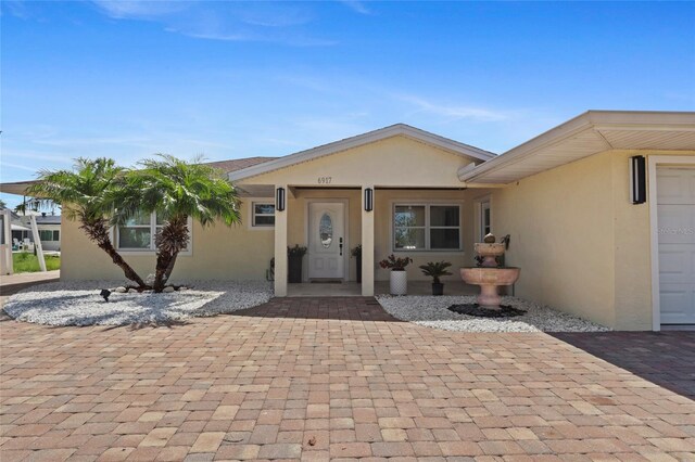 6917 22nd St W, Bradenton, FL 34207 - view of exterior entry with stucco siding