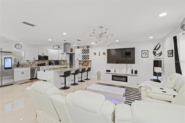 6917 22nd St W, Bradenton, FL 34207 - living room featuring recessed lighting and light tile patterned floors