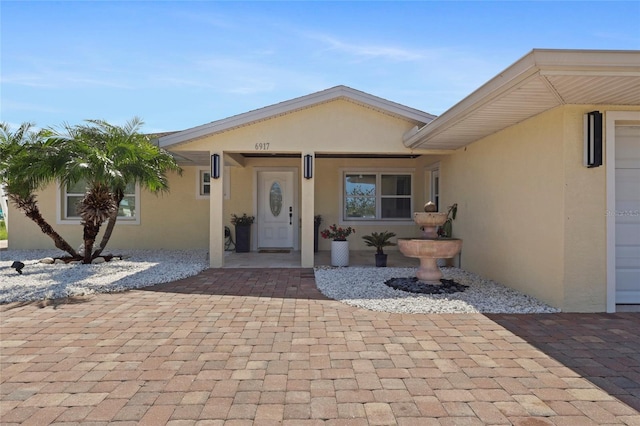 6917 22nd St W, Bradenton, FL 34207 - view of exterior entry with stucco siding