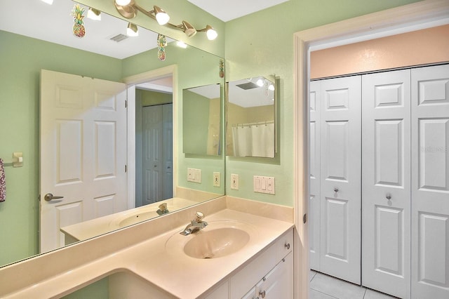 7605 Sweetbay Cir Unit 5-102, Bradenton, FL 34203 - full bathroom featuring a closet, vanity, and tile patterned flooring